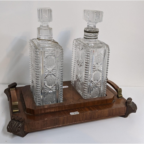 464 - An Art Deco walnut veneered tantalus with two crystal cut decanters, 30h x 37w A/F
Location:LAF