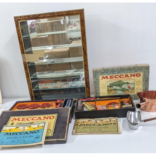 475 - A mixed lot to include two Meccano Engineering toys and manuals together with a wall hanging cabinet... 