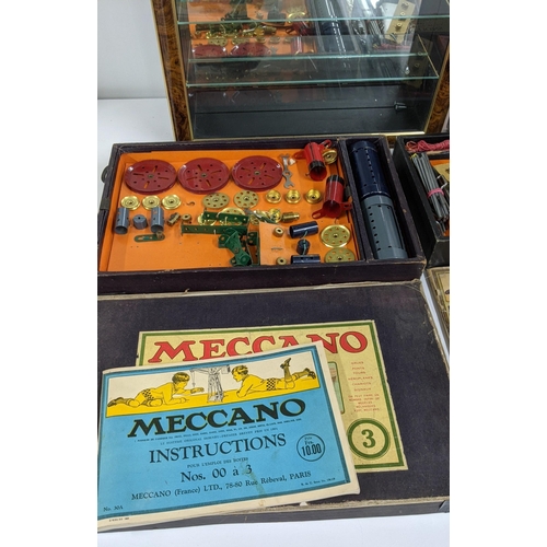 475 - A mixed lot to include two Meccano Engineering toys and manuals together with a wall hanging cabinet... 