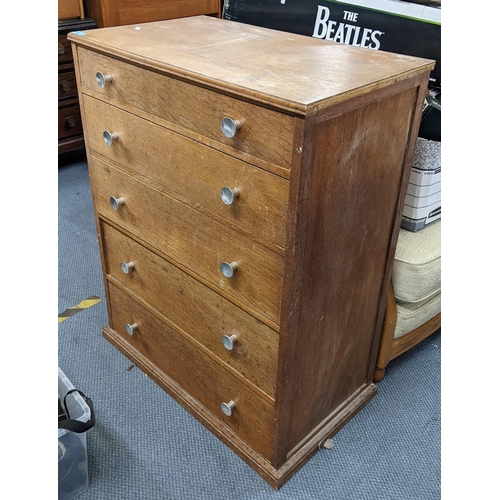 490 - A mid 20th century light oak five drawer chest of drawers on a plinth base, 98cm h x 76cm w
Location... 