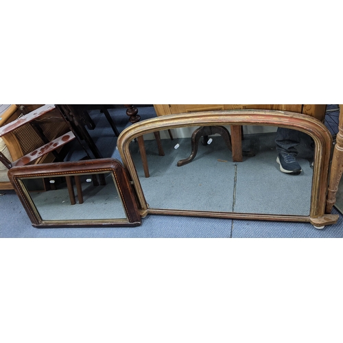 493 - Two late 19th/early 20th century wall hanging mirrors to include a gilt painted and a walnut mirror ... 