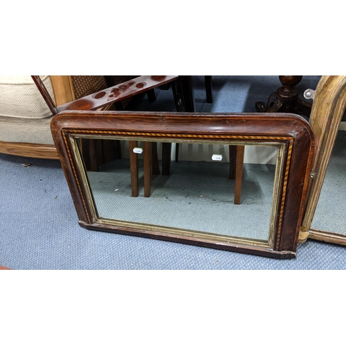 493 - Two late 19th/early 20th century wall hanging mirrors to include a gilt painted and a walnut mirror ... 