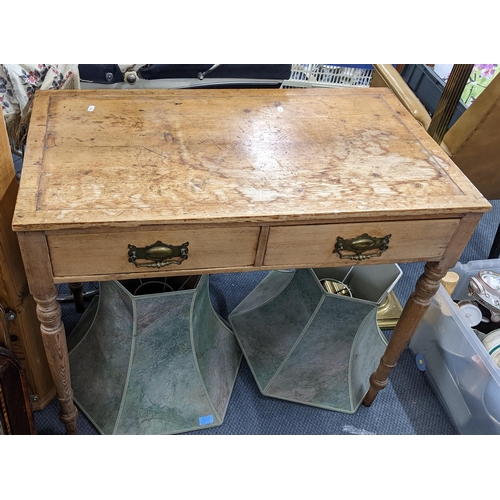 495 - A late Victorian pine two drawer side table on turned tapering legs, 75cm h x 88.5cm w
Location:A2M