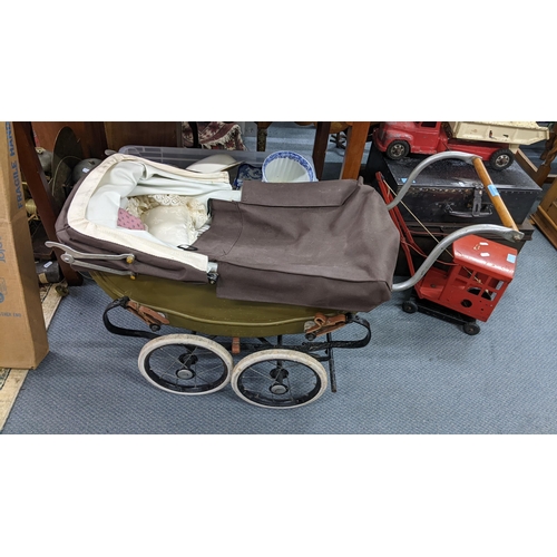 498 - A painted wooden dolls pram with spoke wheels, purchased from Harrods in 1947
Location:A2B