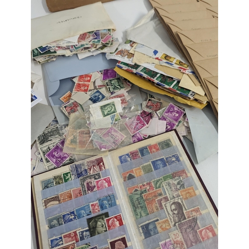 243 - Mixed stamps from around the world to include UK, Japan, China, mixed Commonwealth and others Locati... 