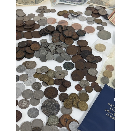 248 - Mixed coins and banknotes to include British early 20th century and later threepence and other examp... 