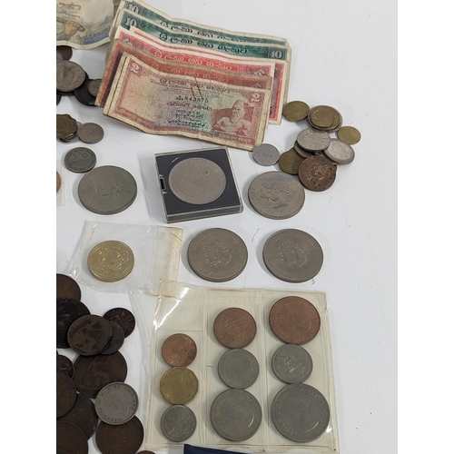 248 - Mixed coins and banknotes to include British early 20th century and later threepence and other examp... 