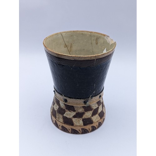 2 - A Martin Brothers stoneware beaker, the waisted cylindrical form with geometric decoration, the lowe... 