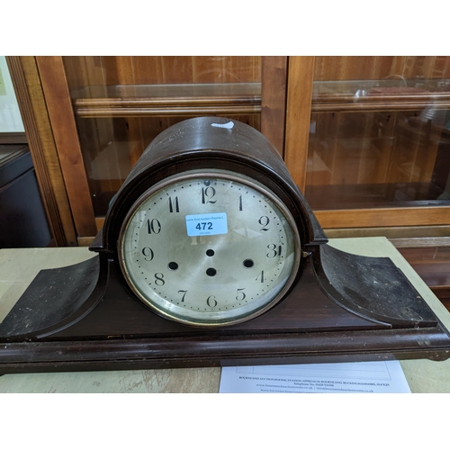 472 - An early 20th century mahogany Napoleon Hat cased mantel clock with silvered Arabic dial, the moveme... 