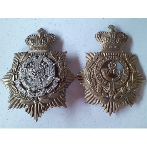 120 - Three Victorian Military interest helmet plates and belt badge including The Border Regiment helmet ... 