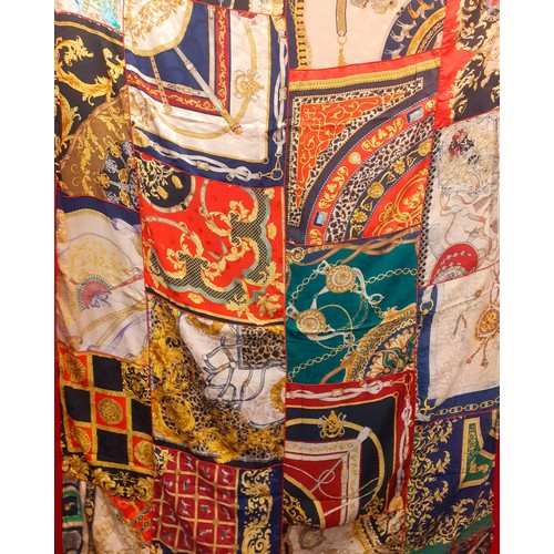 147 - A Renata Balestro silk and wool throw with a Hermes influenced patchwork design on a red silk ground... 