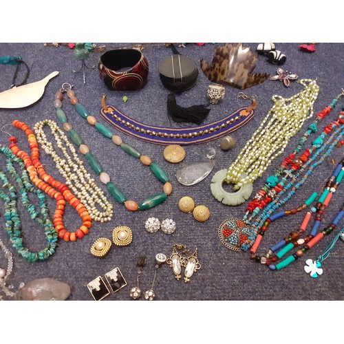 160 - A quantity of costume jewellery, mainly bead necklaces to include an Egyptian style leather and bead... 