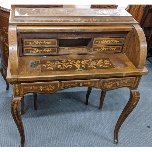 198 - A mid 20th century Dutch style roll top bureau having floral marquetry inlaid, fitted interior above... 