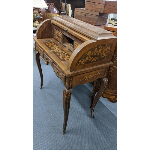 198 - A mid 20th century Dutch style roll top bureau having floral marquetry inlaid, fitted interior above... 