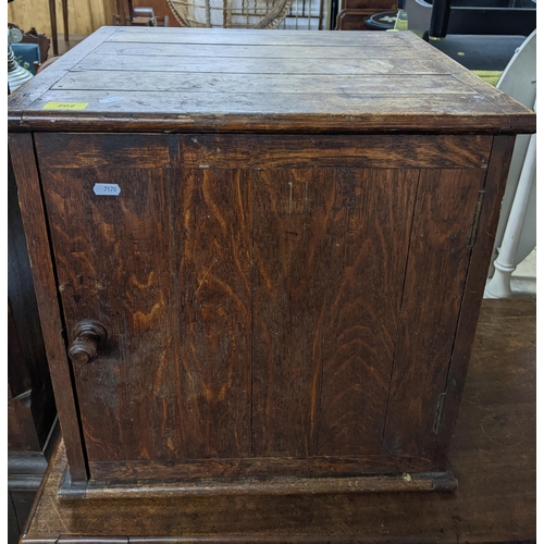 202 - A small oak panelled table top cupboard 53cm x 53cm x 48cm Location:G