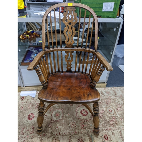 223 - An early 20th century Windsor comb back armchair, crinoline stretcher, on ring turned legs
Location:... 