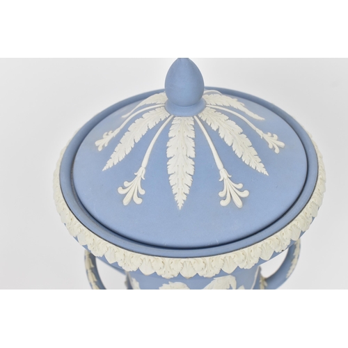 14 - A Wedgwood blue jasperware campana lidded urn, 20th century, with twin handles either side, the body... 