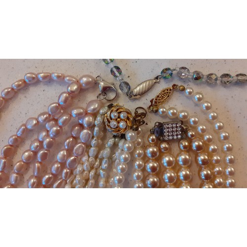 156 - Seed pearl, pink pearl and simulated pearl necklaces, some with silver or silver gilt clasps togethe... 