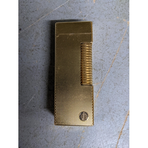 472 - A Dunhill gold plated cigarette lighter Location:CAB1