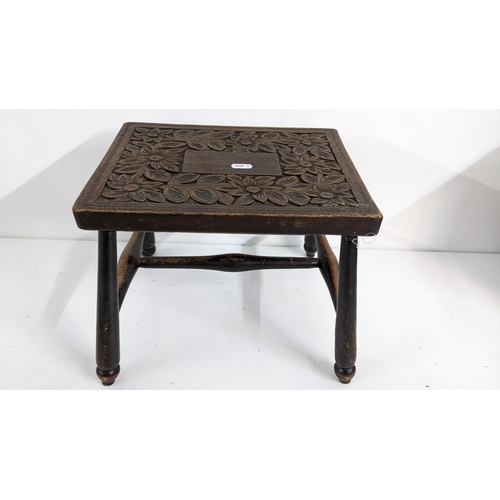 482 - An early 20th century oak stool having a heavily carved floral top, 26cm high x 31cm wide
Location:A... 