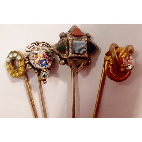 58 - A collection of 20th Century hat pins to include a Scottish white metal and hard-stone example and a... 