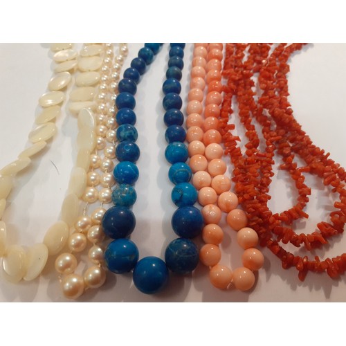 59 - A small quantity of vintage necklaces comprising Lapis Lazuli, coral to include one with a 9ct gold ... 