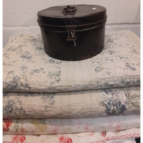 103 - A 1930's metal hat box together with a late 20th Century machine made double quilt in white with pin... 