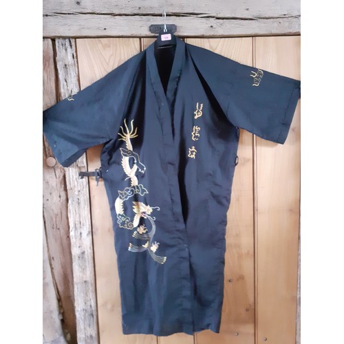 109 - A modern Asian embroidered black robe, no belt. Location:Rail