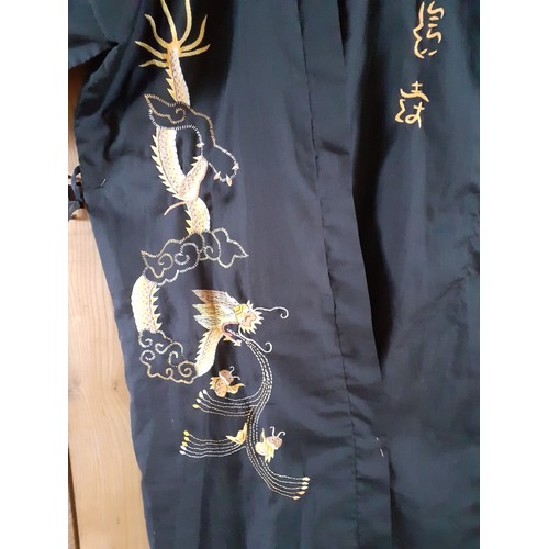 109 - A modern Asian embroidered black robe, no belt. Location:Rail