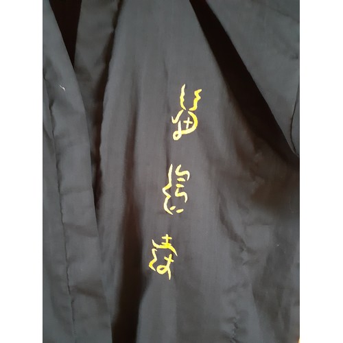 109 - A modern Asian embroidered black robe, no belt. Location:Rail