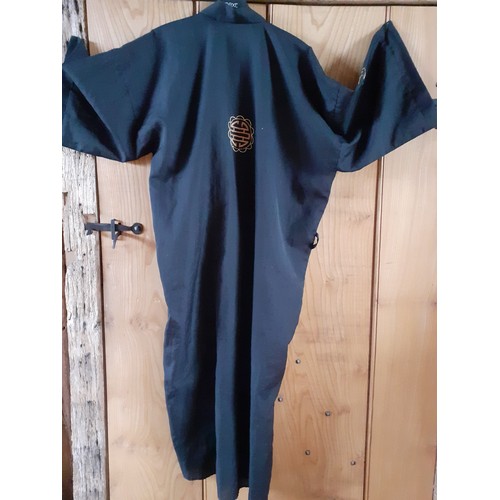 109 - A modern Asian embroidered black robe, no belt. Location:Rail