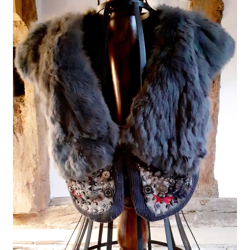 73 - A group of fur trimmed clothing and accessories comprising a Ruiyge navy cashmere mix cape with 2 du... 