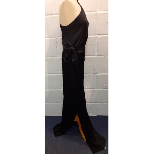 7 - Gucci-A ladies black silk off the shoulder and full length evening gown, European size 40 having bow... 