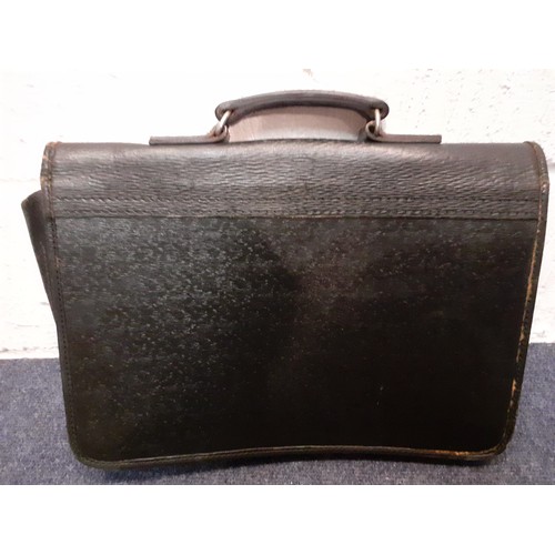 70 - An Elizabeth II Government/Royal Household Royal Cipher embossed black attache case together with an... 