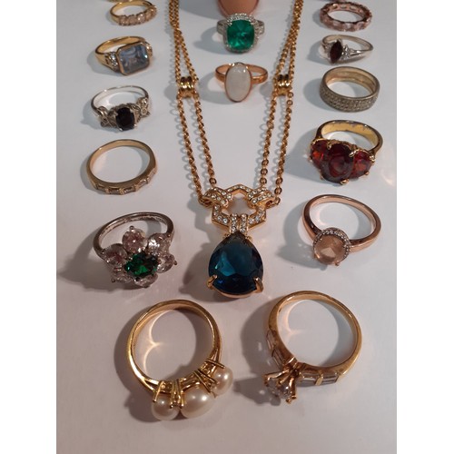 81 - A quantity of modern gold tone, silver tone and silver dress rings with glass tones, cubic zirconias... 