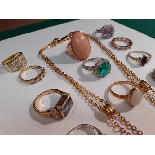 81 - A quantity of modern gold tone, silver tone and silver dress rings with glass tones, cubic zirconias... 