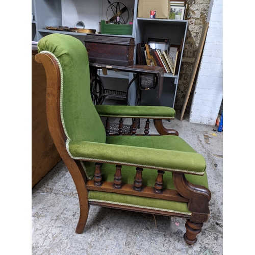 128 - Victorian mahogany and upholstered open armchair, arms supported by four turned columns on turned fr... 