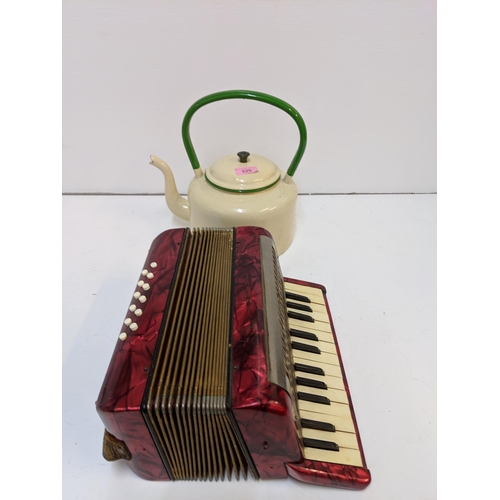 197 - A mid century painted metal teapot and a Hohner piano accordion in a mottled red case
Location:7.4