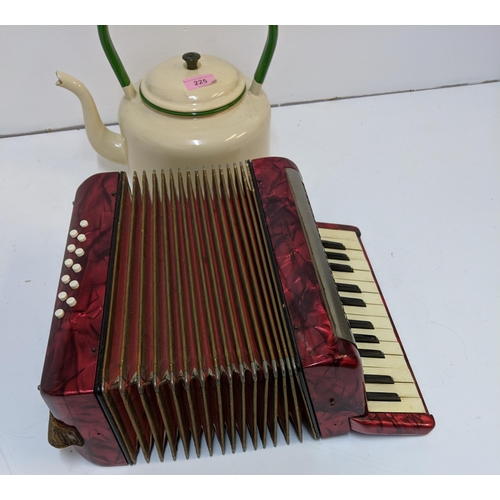 197 - A mid century painted metal teapot and a Hohner piano accordion in a mottled red case
Location:7.4