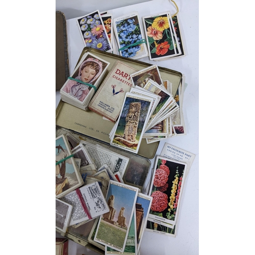 202 - A collection of cigarette cards to include an album containing mainly complete sets to include Airme... 