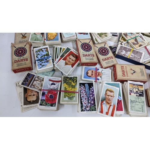 202 - A collection of cigarette cards to include an album containing mainly complete sets to include Airme... 