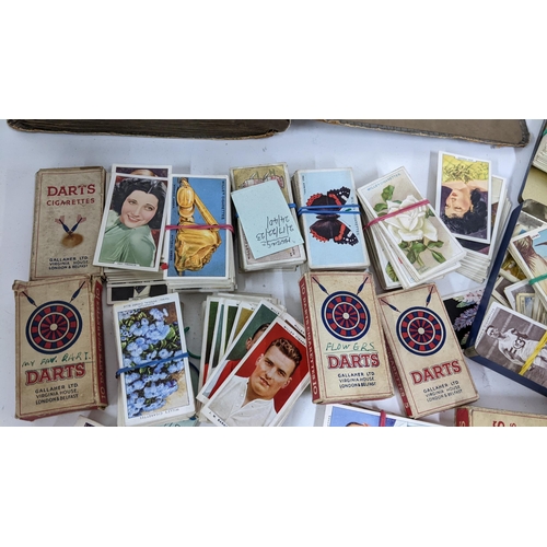 202 - A collection of cigarette cards to include an album containing mainly complete sets to include Airme... 