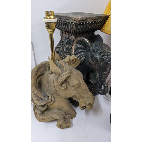 112 - A mixed lot to include a cast metal bronze coloured Thai figurine, a resin pierced elephant lamp, A/... 