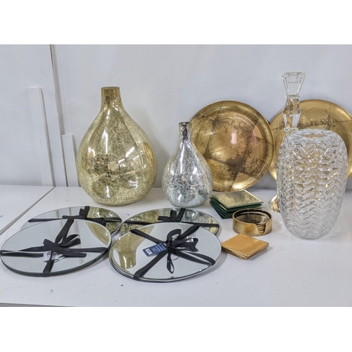 114 - Mixed modern items to include two crackle glass vases, eight glass place mats, coasters and other it... 