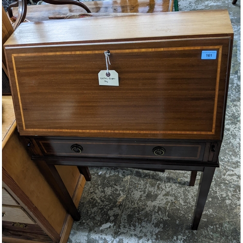 161 - An inlaid mahogany bureau, fall flap revealing a single shelf to interior, above a drawer, on square... 