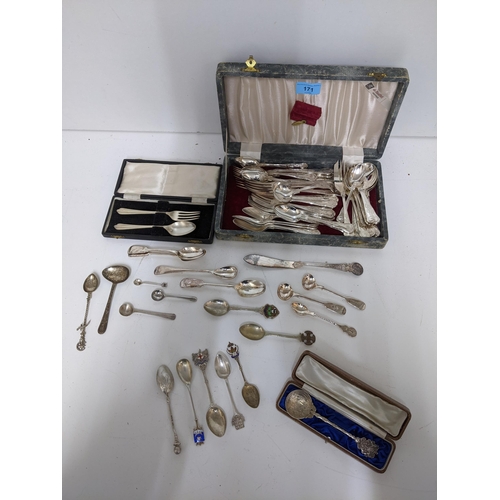 171 - A selection of silver and silver plated flatware to include silver and enamelled souvenir spoons, a ... 