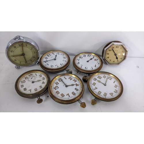 252 - A selection of 8 day travel clocks, together with an alarm clock, Location:T