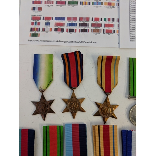 295 - War medal ribbons and a department of defence US plaque, a cased achievement medal embossed with an ... 