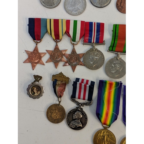 297 - Mixed WWI and WWII service medals, to include British war, Stars, a copy and dog tab 'Holdstock', Lo... 