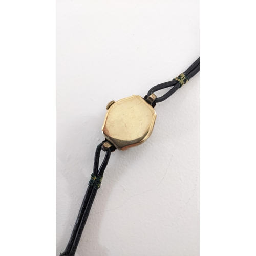 35 - A vintage Rotary ladies 9ct gold manual wind wristwatch on a black leather strap 
Location:CAB4